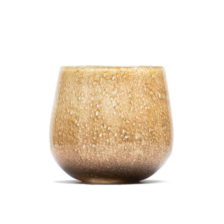 A beige and brown speckled ceramic vase with a round shape on a white background.