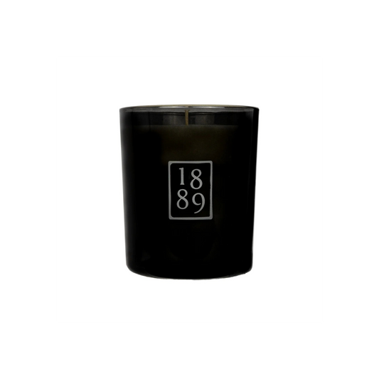 Black candle with '1889' logo on a white background