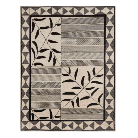 Rug with geometric and leaf pattern on a white background